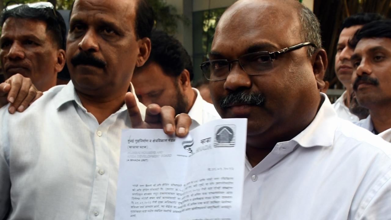 Anil Parab met MHADA officials and addressed the press outside MHADA office. He also showed a letter from the housing authority that says he is not associated with  illegal constructions.