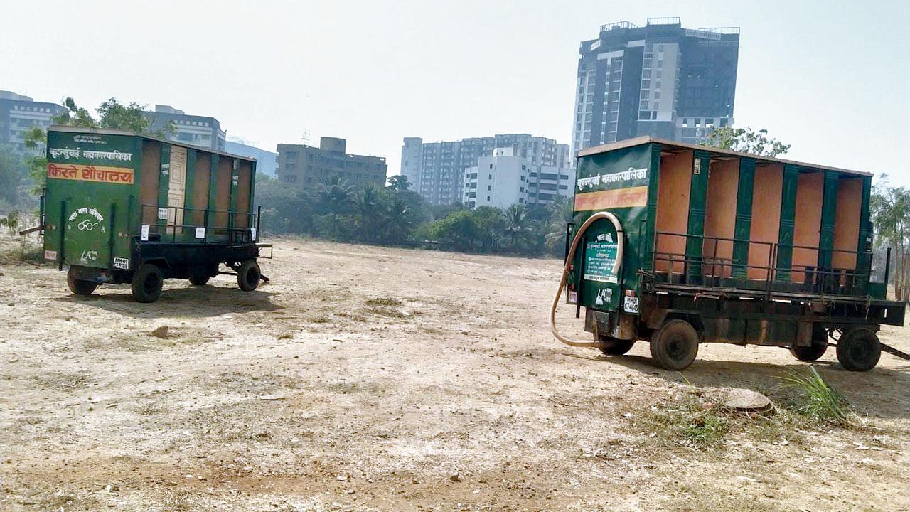 The mobile toilets parked near the helipad