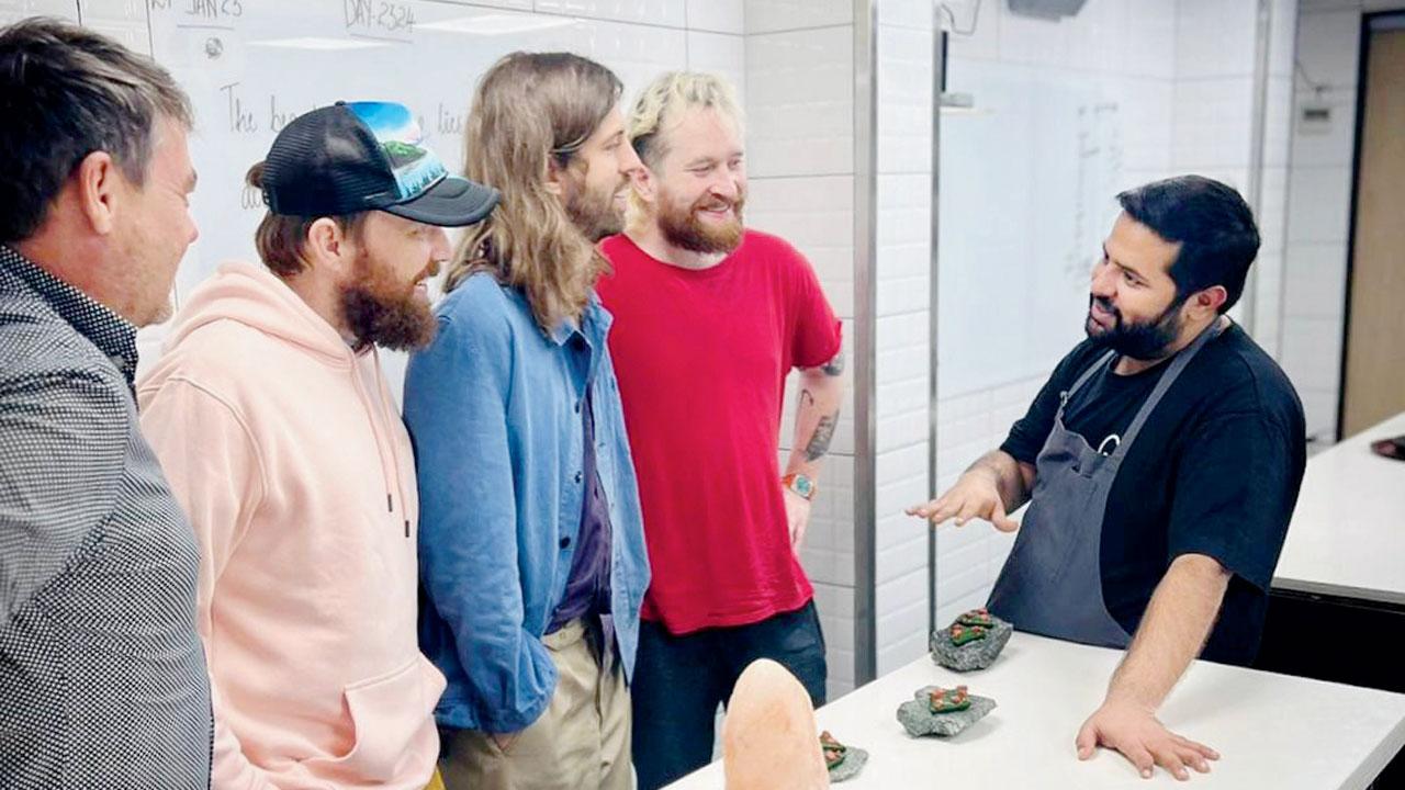 Imagine Dragons with chef Varun Totlani at Masque. Pic/Instagram