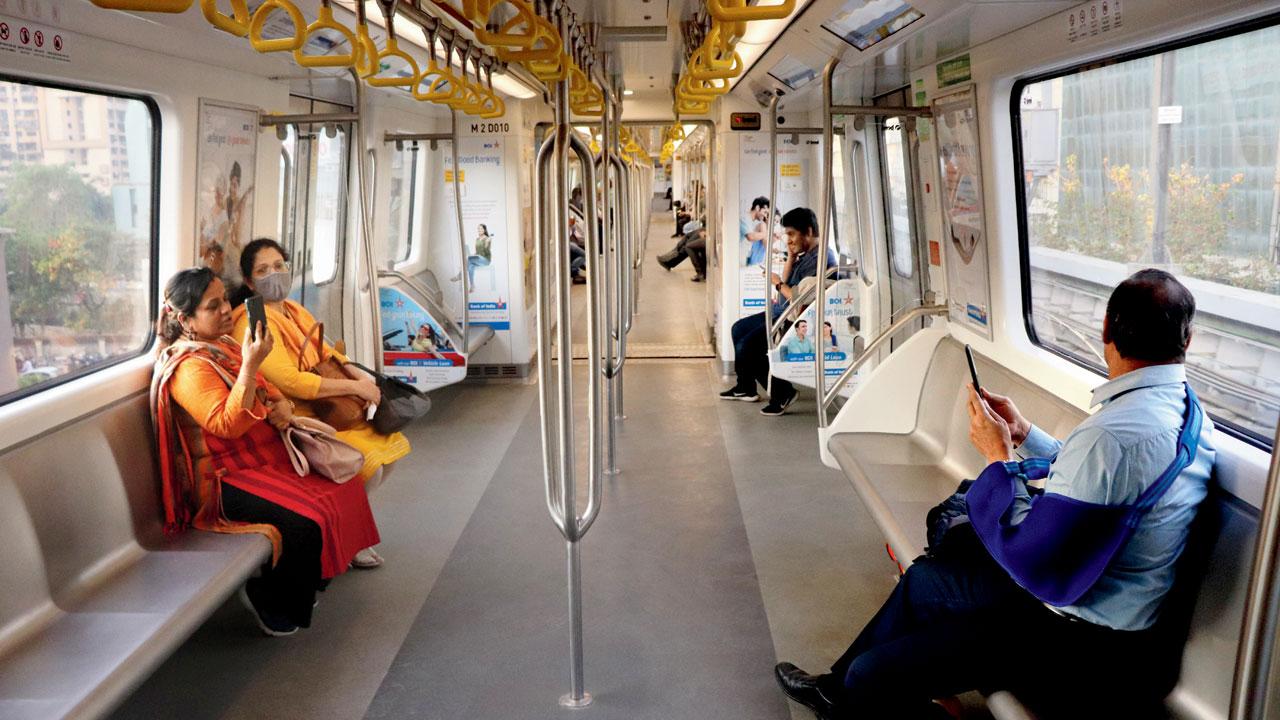 Commuters aboard a Metro train on the newly inaugurated Metro Line 7. Pics/Anurag Ahire