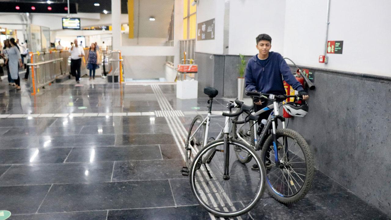 A youngster seen travelling with bicycles at DN Nagar Metro station