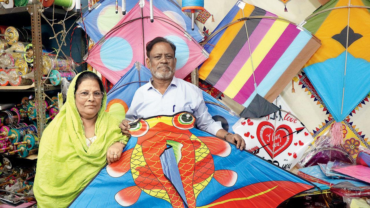 Nasim and Ahmed Kazi show off a decorative kite