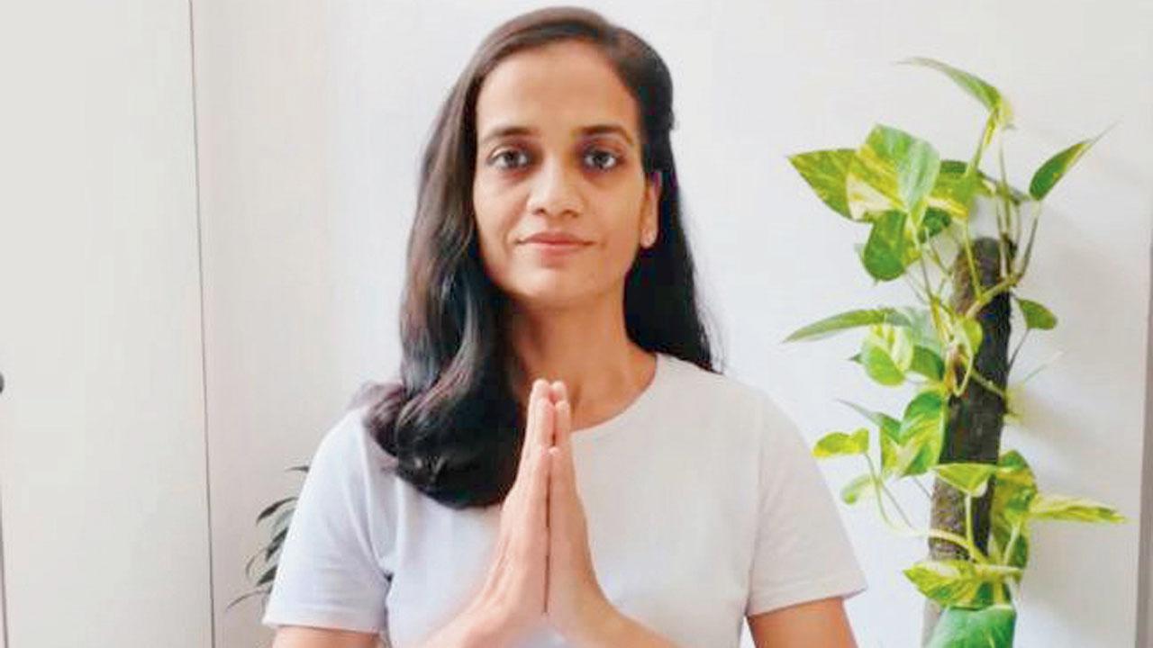 Rachna Jain prepares for meditation in the Gomukhasana pose