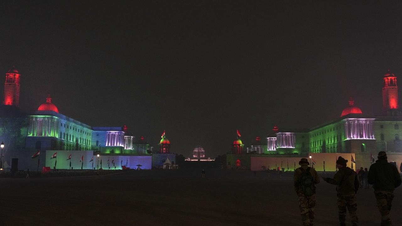 A multi-layer security cover has been put in place ahead of Republic Day celebrations in the national capital to thwart any untoward incident. Police have stepped up anti-sabotage checks, verification drives and patrolling. Around 6,000 security personnel will be deployed and a total of 24 help desks will be set up in Delhi for those who will attend the celebrations, the officials said. Meanwhile, Raisina Hills were seen illuminated in tricolour as part of Republic Day celebrations.