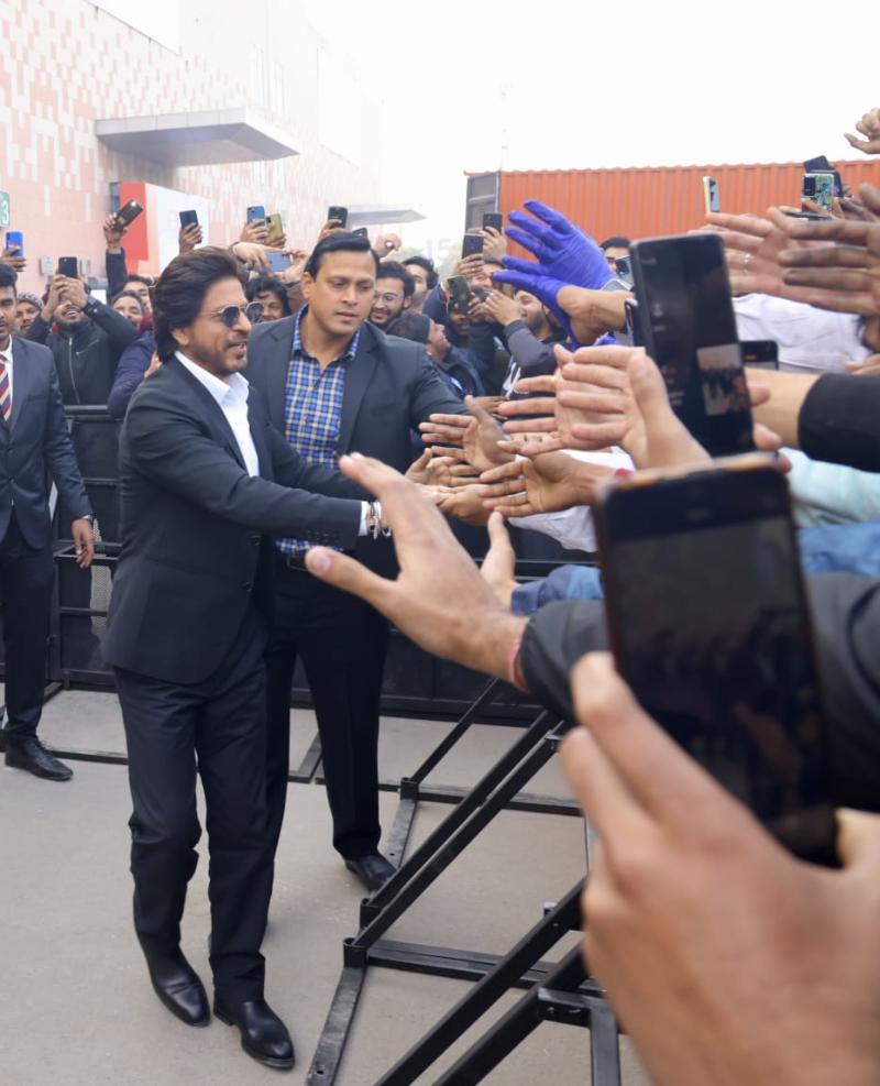 In pics: 'Pathaan' star Shah Rukh Khan shakes hands, blows flying