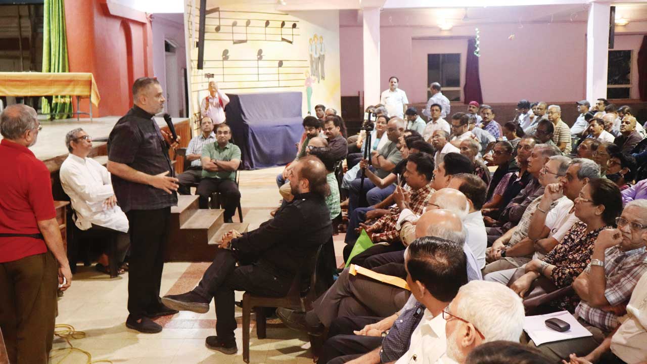 Parishioners had turned up in large numbers to sign a petition against the cemetery wall demolition, on Friday. Pic/Anurag Ahire