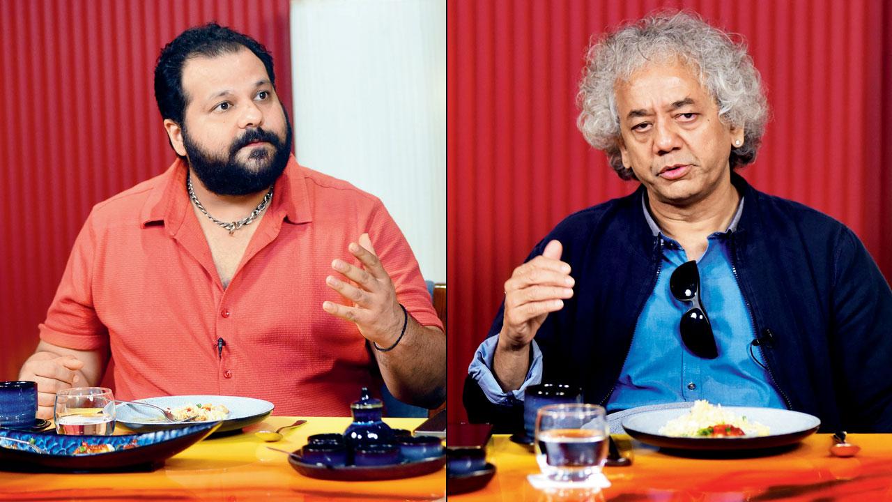 Gino Banks (right) Ustad Taufiq Qureshi share thoughts over lunch