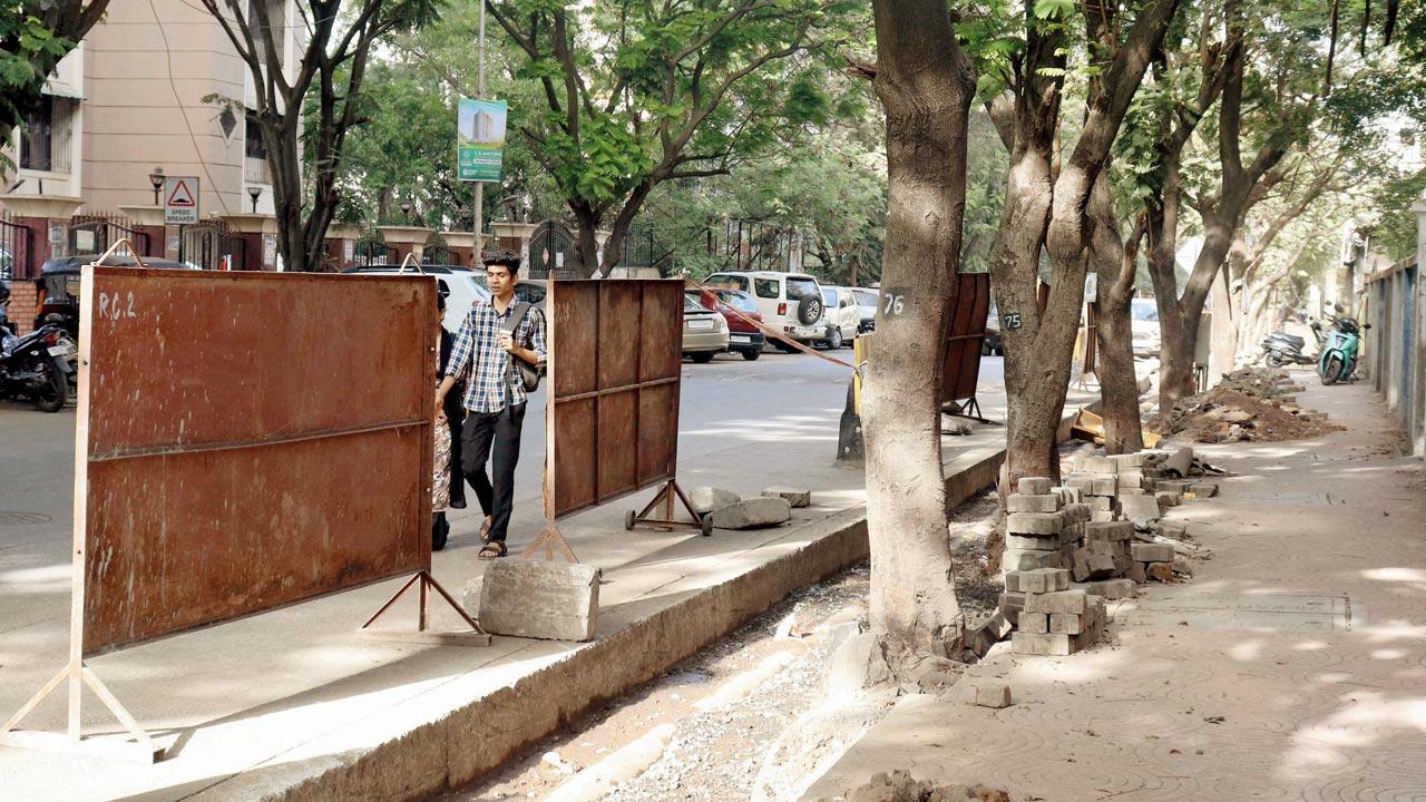 Parking and dug-up footpath choke this road in Mulund East, say Rajendra