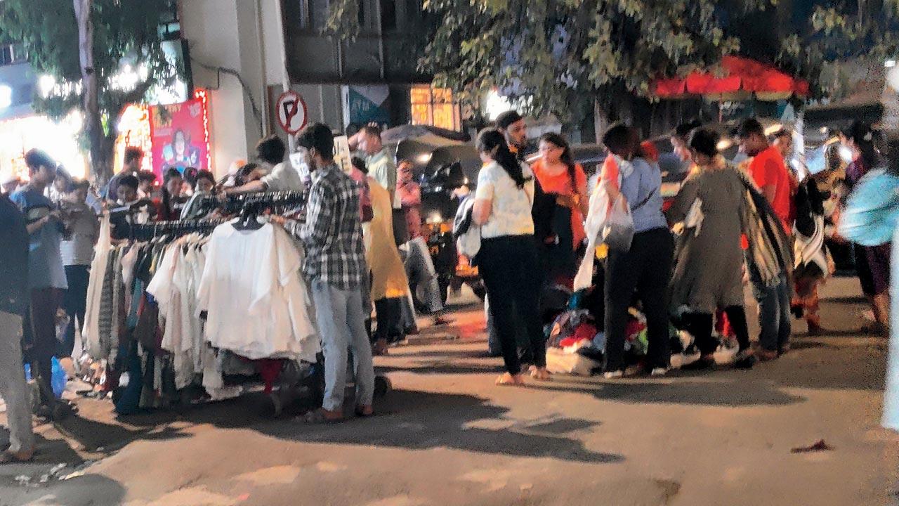 Illegal hawkers set up stalls to sell their wares at Hill Road, Bandra West. File pic