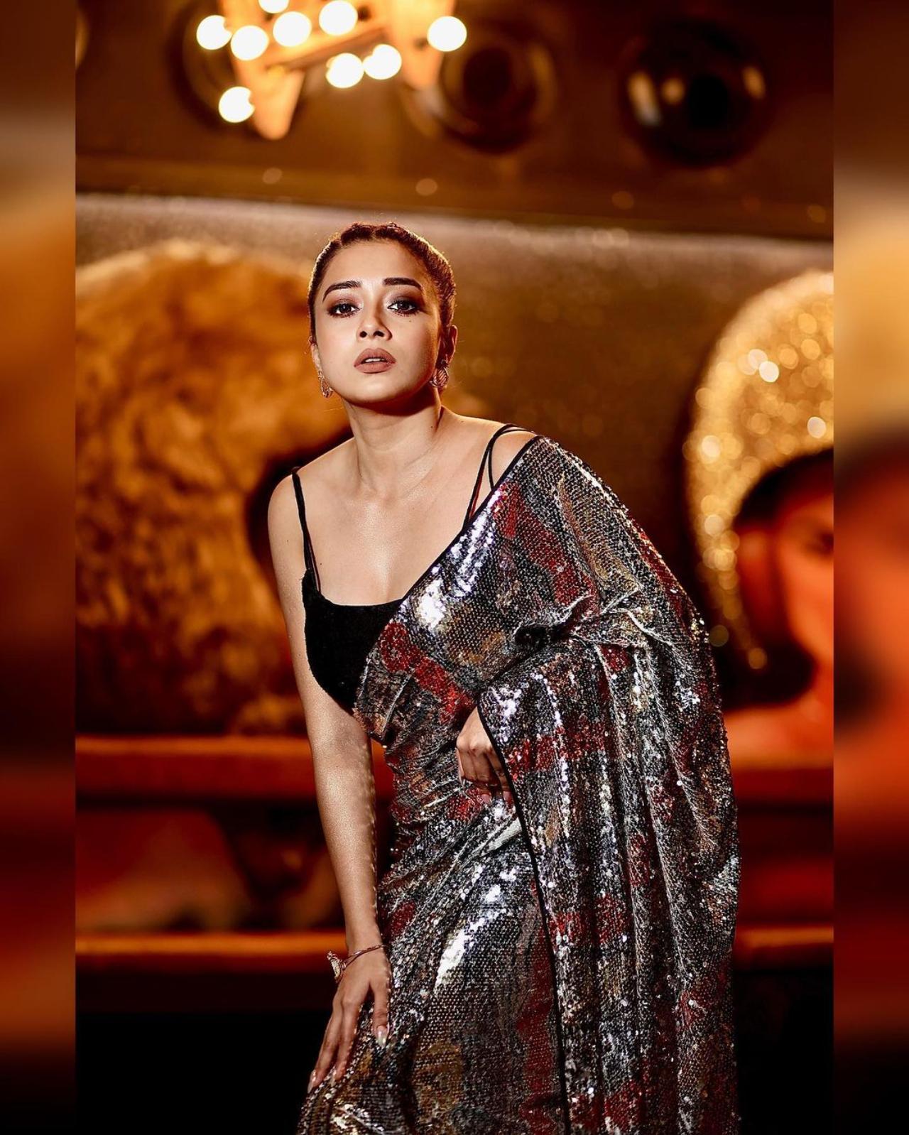 Silver Saree:
This silver saree from Tina's wardrobe is our ultimate steal outfit! Looking absolutely gorgeous in this indo western saree, pulled back hair and subtle makeup to complete the look, Tina is flawless in this attire
