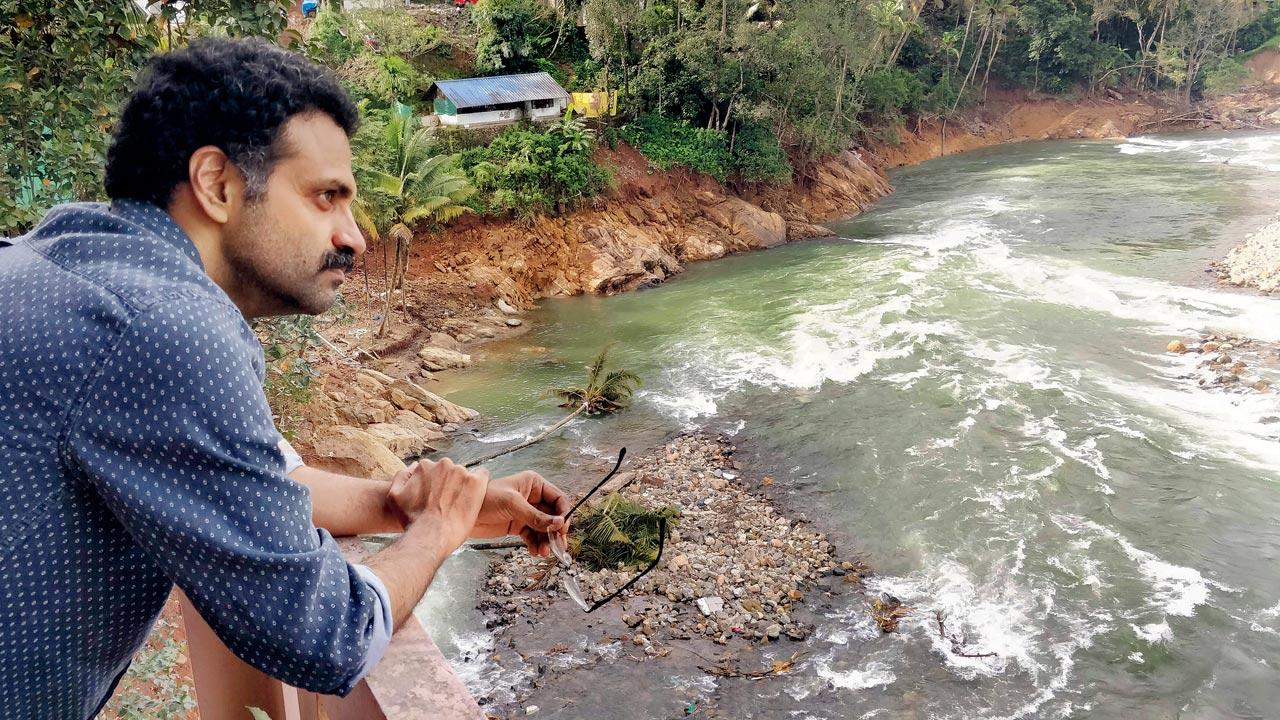 Journalist Viju B at a hotel facing Cheruthoni river in Idukki. The river had flooded the township when the shutters of Cheruthoni dam were opened. “All the 48 rivers in Kerala flowing down from Western Ghats have been encroached and this is one of the major reasons why water flooded the towns in 2018 floods,” he says