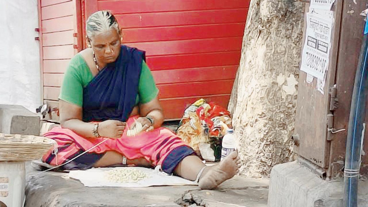 A woman sells flowers on the street. Pic Courtesy/Kimaya Tendulkar