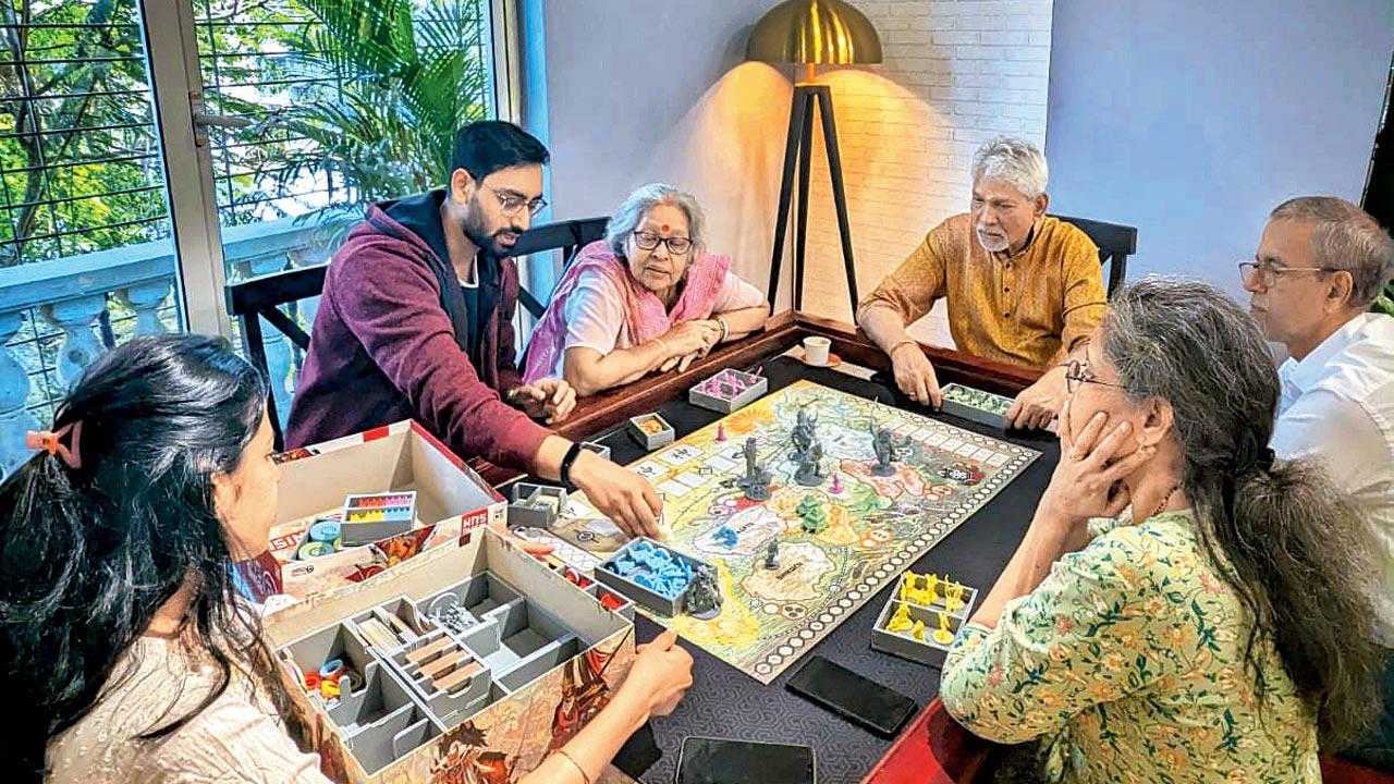 Enthusiasts engaged in a board game at the café