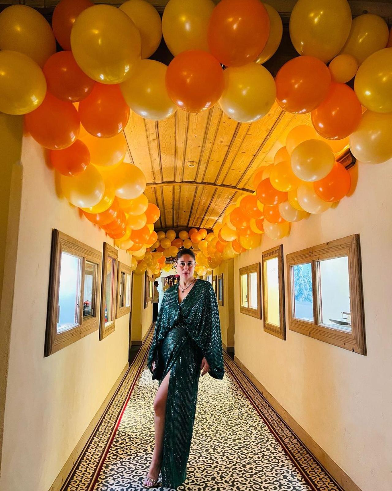 Kareena Kapoor looked absolutely stunning in her New Year's eve outfit. The actress donned a glittery green gown with a deep neck. She took to her Instagram handle to share pictures of her posing in her outfit. She is seen posing in a room decorated with yellow balloons on the ceiling