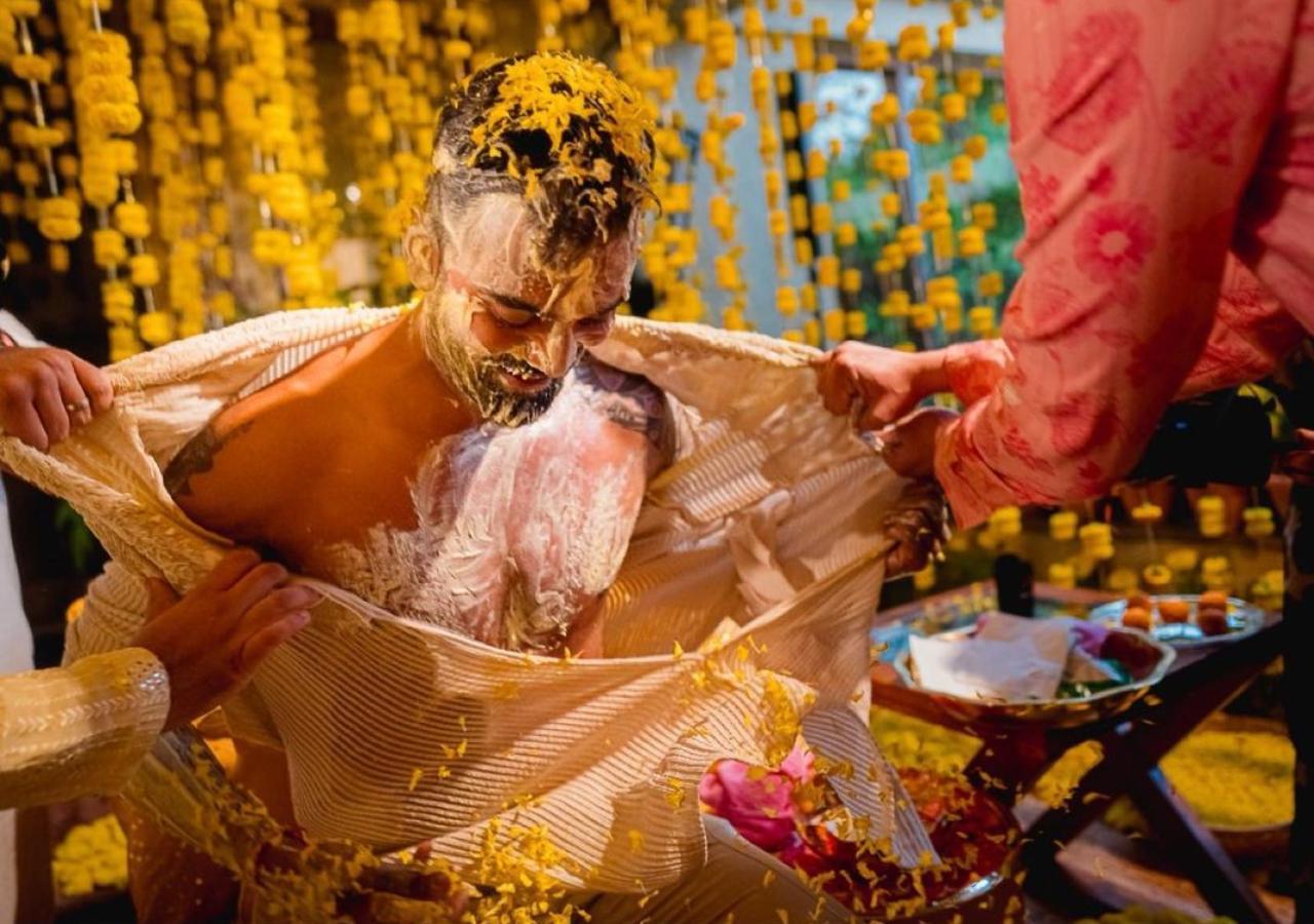 However, the kurta did not have a long life as friends of the groom tore his kurta and covered him in haldi