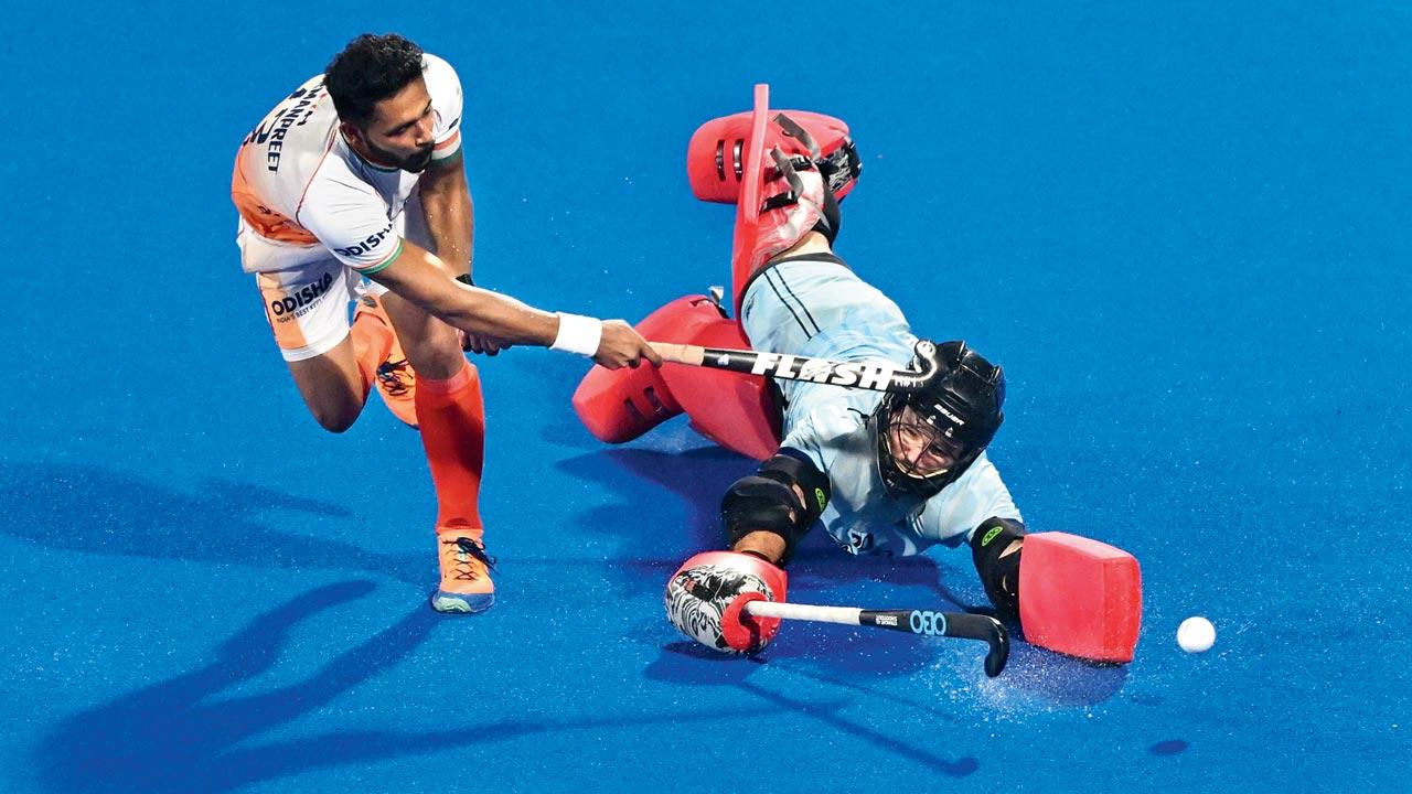 India’s Harmanpreet Singh scores during a penalty shootout during a Crossover game against New Zealand in Bhubaneswar yesterday. Pic/AFP