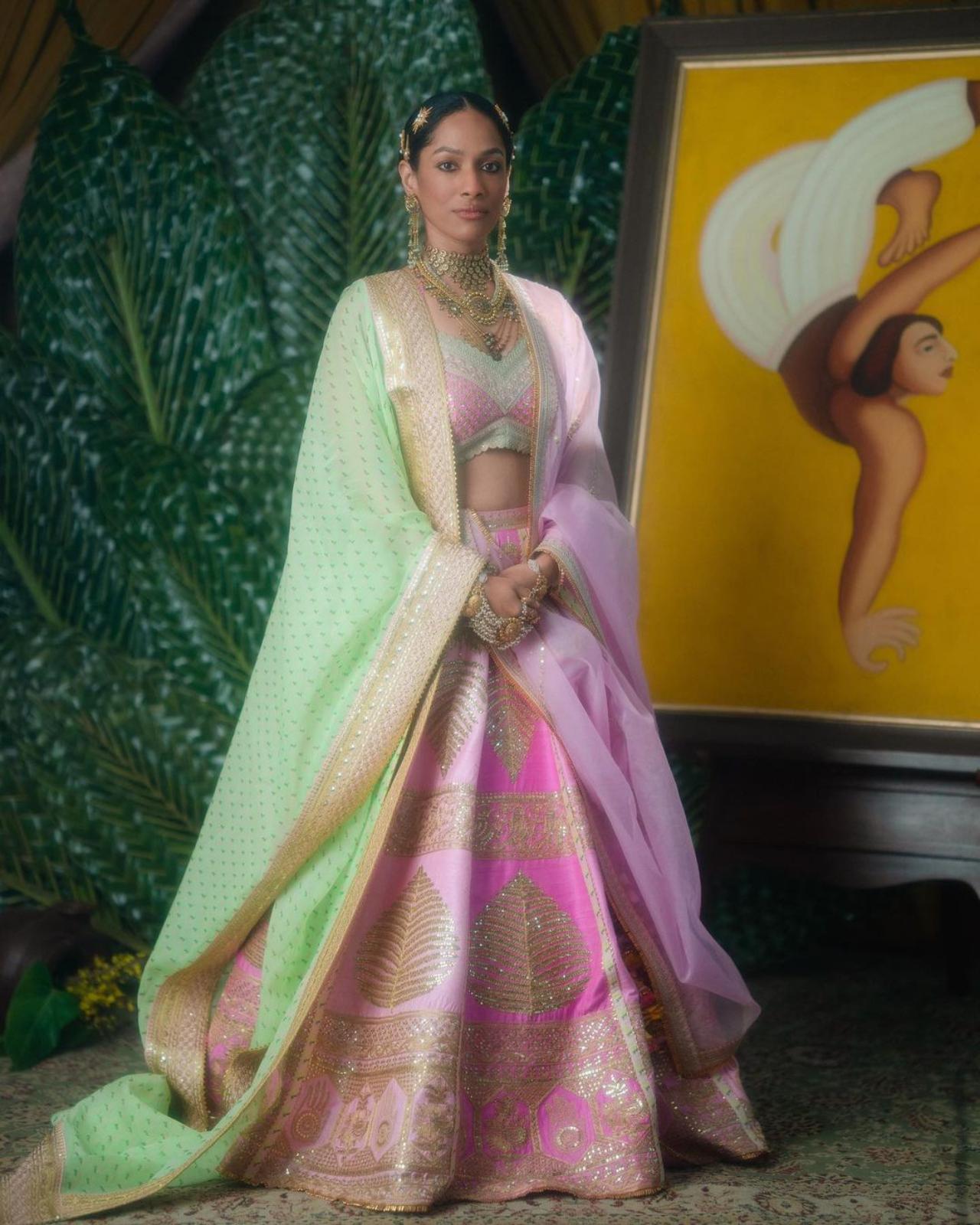 Masaba and Satyadeep twinned in shades of pink for the wedding. Masaba looked ethereal in a barfi pink raw silk lehenga with gold embroidery and a lime green dupatta with a wallflower print on it. Satyadeep opted for a barfi pink wallflower bandi and a comfortable kurta-pyjama. Both of them wore outfits from House of Masaba's bridal collection