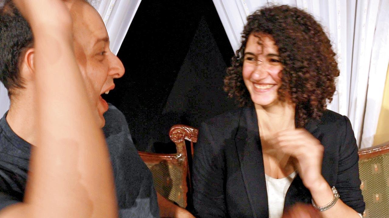 Divya Cowasji shares a laugh with singer Hormuz Ragina