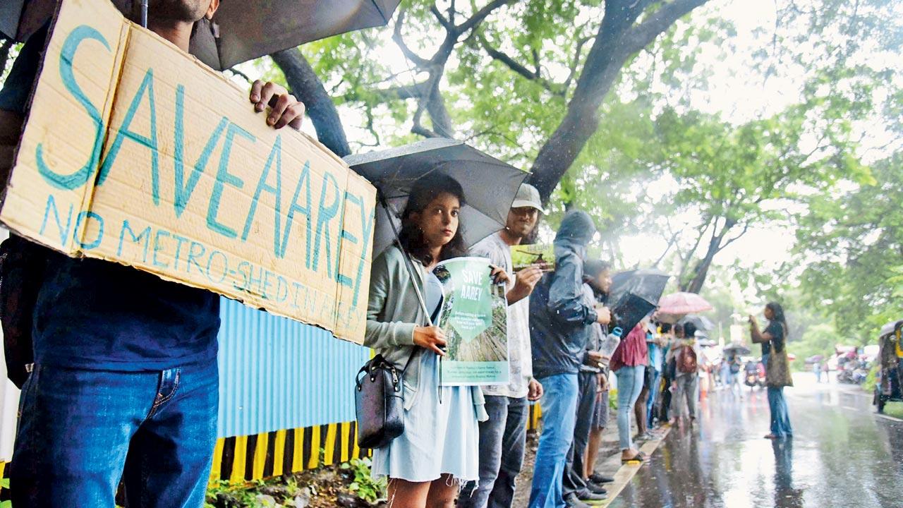 Citizens protest the chopping of trees for the Metro car shed in Aarey. File pic/Sameer Markande