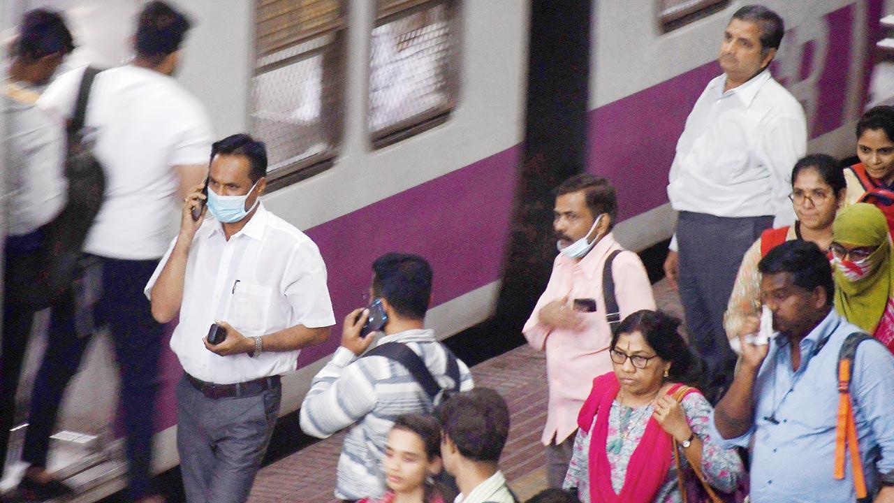 Commuters exercise caution by donning masks at CSMT. File pic