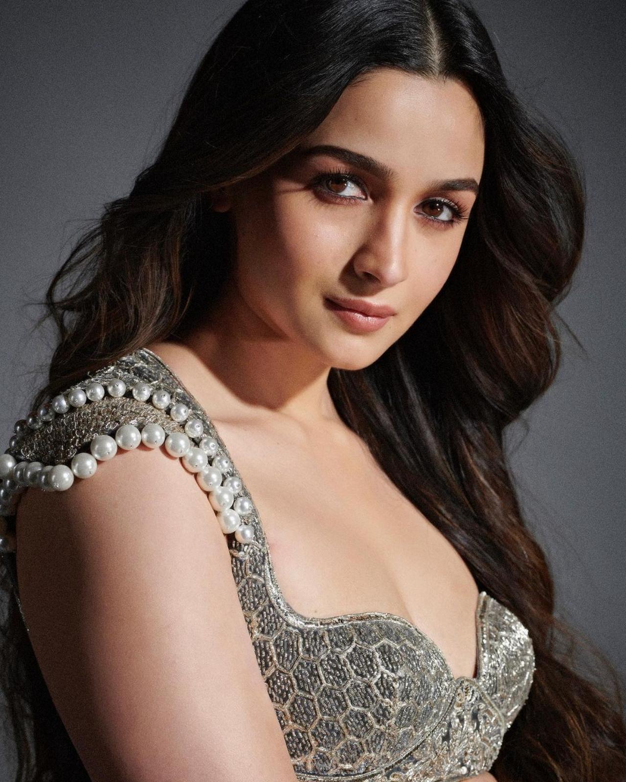 Karan Johar's brand of cinema includes grandeur and opulence, and how can one miss out on the clothing? The Rocky-Rani movie is filled with a vibrant and showstopping array of outfits - and the actors are outdoing themselves with the promotions. Alia's minimal makeup brough out the embroidery and intricate work of her ethnic blouse