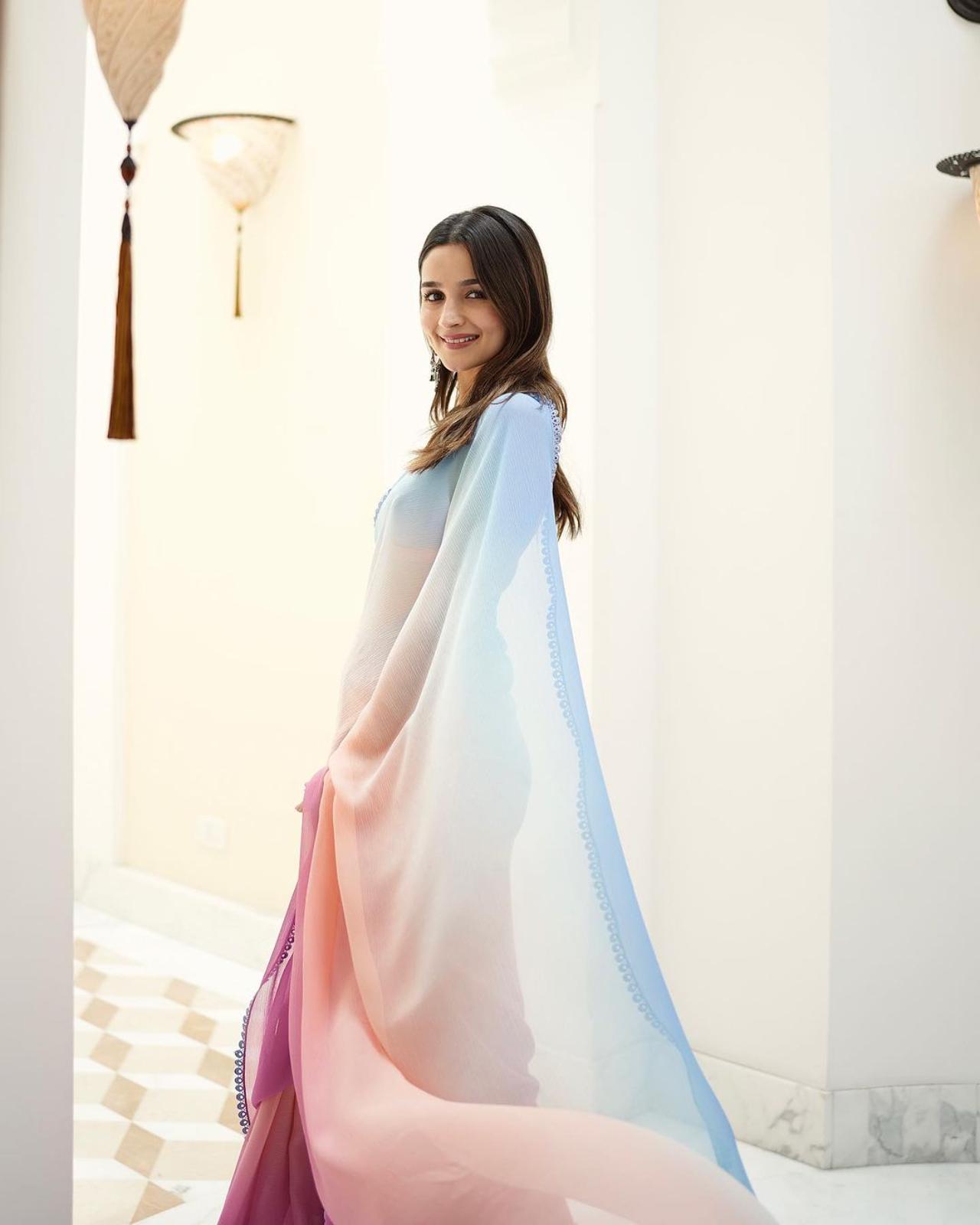 Chiffon sarees are a staple in the wardrobe of the Karan Johar heroine over the years. Alia dazzled in the different sarees she wore throughout the promotions - this beautiful sky blue and pastel pink saree perfectly captures the feel-good essence of the movie