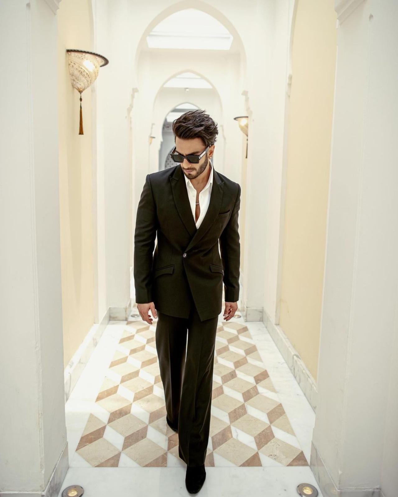 Style epitomized - no words need to be said for debonair Ranveer Singh as he walks towards the camera in his black suit