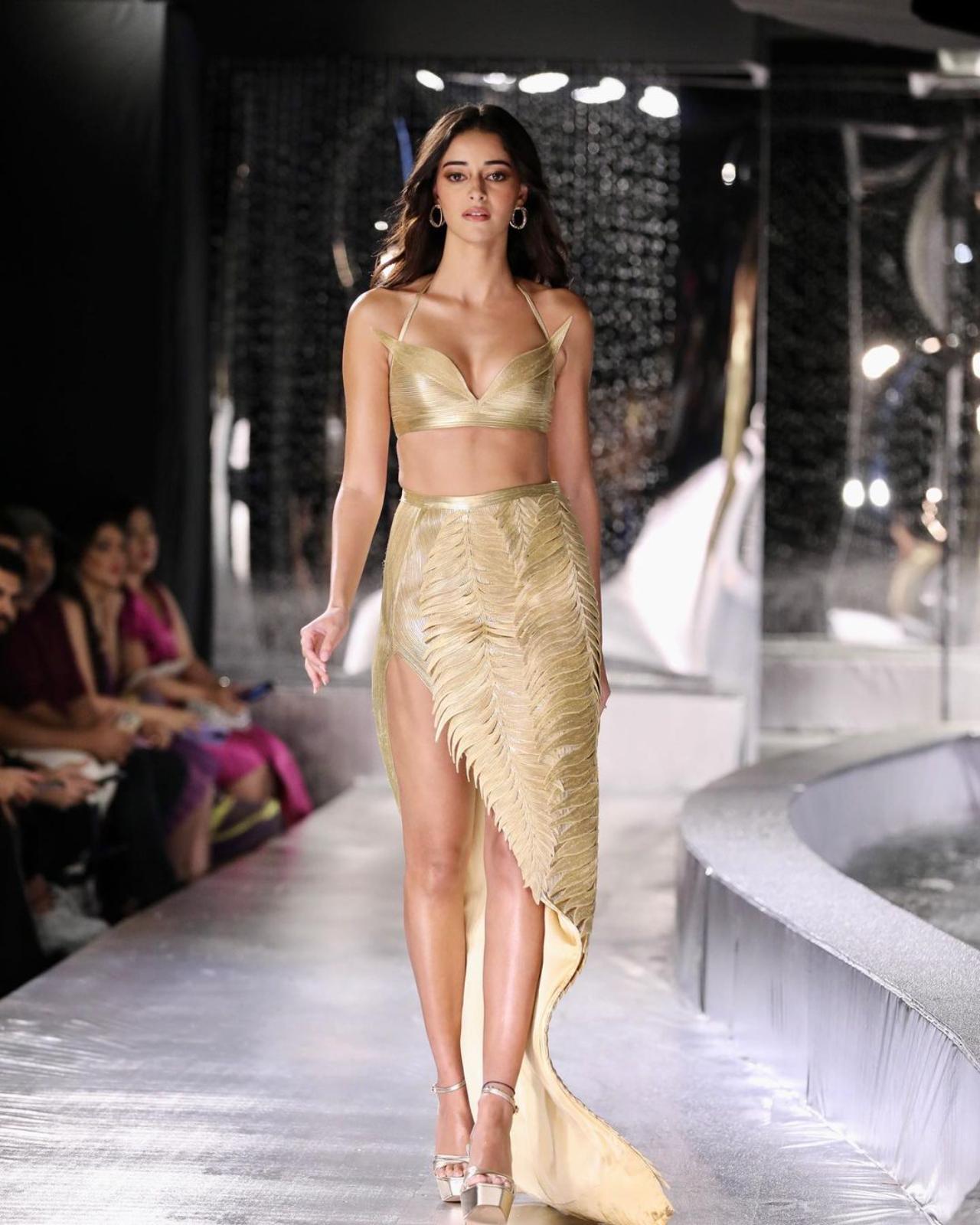 Ananya Panday evoked hushed reverence through her 'Golden Bird' look for the collection. The unique train at the back of the dress curved in an unusual style, embodying the spirit of water