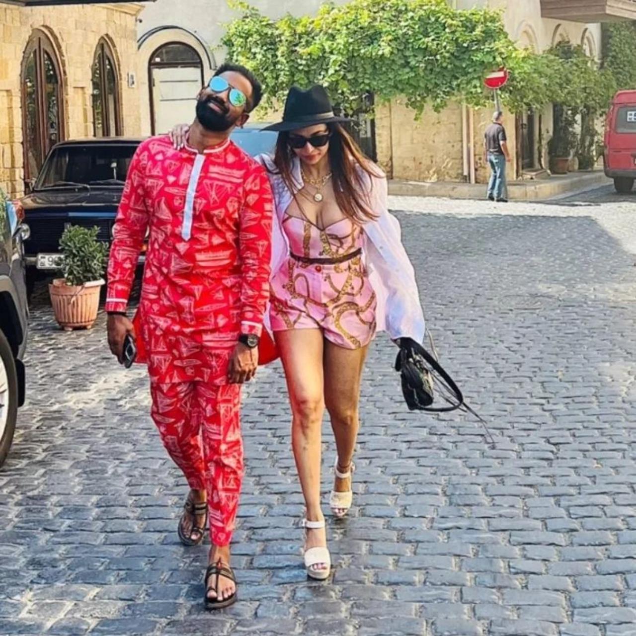 The diva looks stunning in this pink co-ord set. She channelized her inner Barbie during the trip and captioned the photo `Barbie Arora.` The actress is twinning with Sarvesh Shashi who looks equally glamorous in his red co-ord outfit The diva looks stunning in this pink co-ord set. She channelized her inner Barbie during the trip and captioned the photo `Barbie Arora.` The actress is twinning with Sarvesh Shashi who looks equally glamorous in his red co-ord outfit