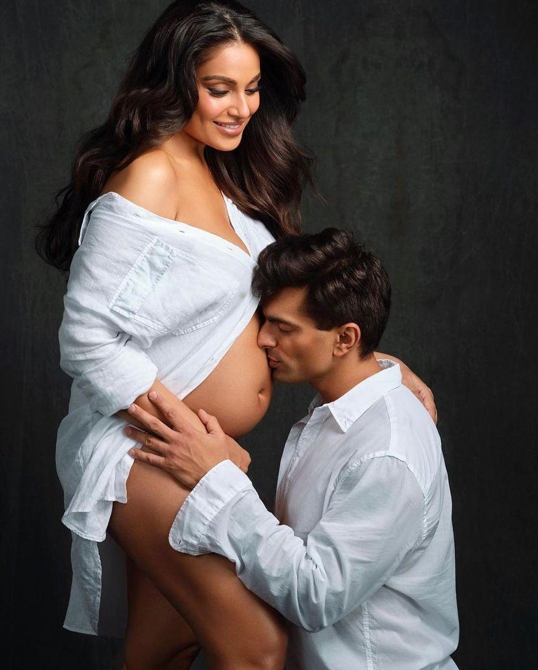 In a heartwarming display of love and anticipation, Bipasha Basu and her doting husband come together for a maternity shoot that melts hearts