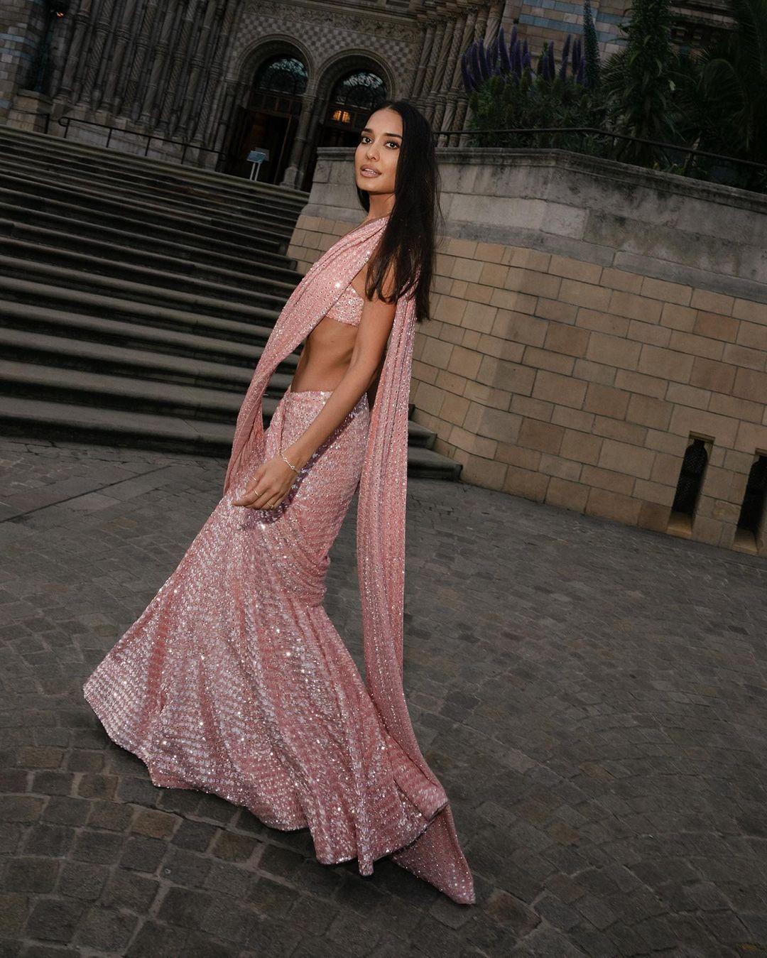 Mesmerizing in pink: Lisa Haydon shines in a saree adorned with glittery embellishments, paired with a strapless blouse by Arpita Mehta