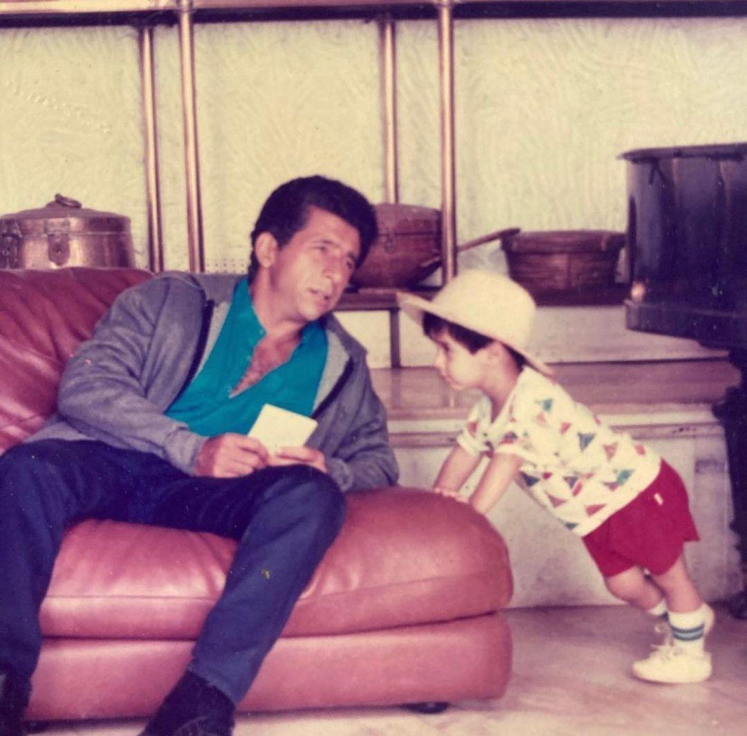 In this captivating photograph, a young Vivaan can be seen with his father, gazing into the distance with an air of sophistication. Holding onto a set of cards, Naseeruddin exudes a suave aura while Vivaan joyfully revels in the presence of his legendary father.
