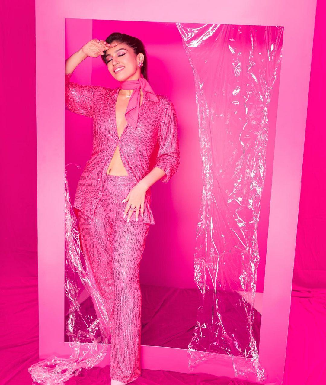 Bhumi Pednekar graces the scene with her enchanting presence, adorned in a glittery pink co-ord set that exudes glamour and charm. 