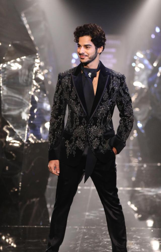 Ishan Khatter looked effortlessly debonair in a tailored black blazer adorned with shimmering embroidery and straight-cut satin pants