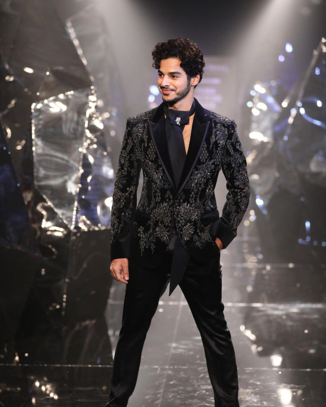 Ishan Khatter looked effortless debonair in a tailored black blazer adorned with shimmering embroidery and padded shoulders. He paired it with classy straight-cut satin pants