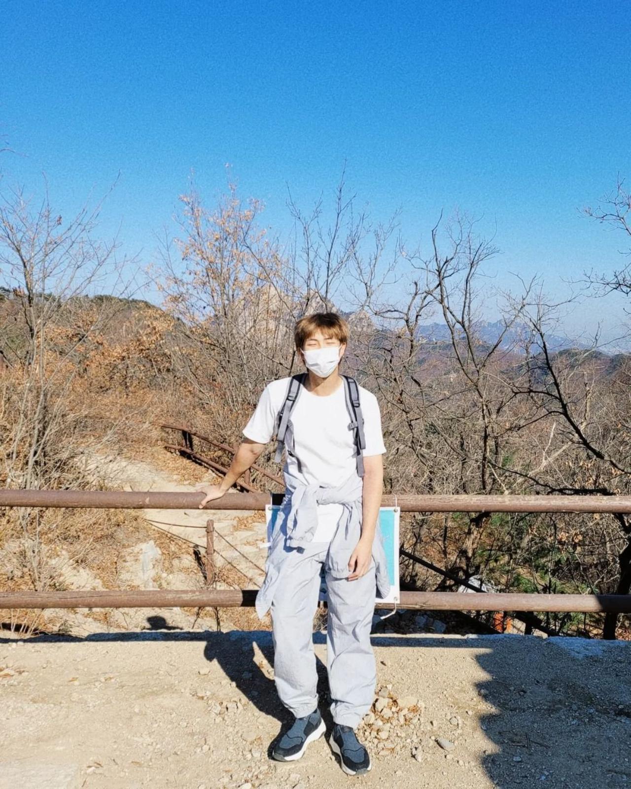 Given his love for the outdoors, Namjoon has said that he enjoys bicycling and hiking to get away from the rush hours of Seoul. He looks all ready for a trek in this simple white t-shirt and grey sweatpants. Look at that hoodies just nonchalantly tied around his waist! Namjoon wasn't kidding when he said that BTS are just a group of '20 something year old guys'