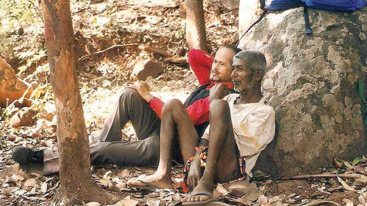 Janiv founder Sharad Ovalekar relaxes with a villager during one of their many visits