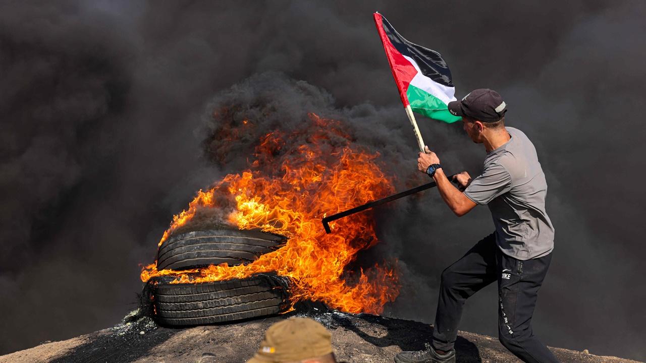 Black smoke rose from the crowded streets of the camp, exchanges of fire rang out and the buzzing of drones could be heard overhead as the military pressed on. 