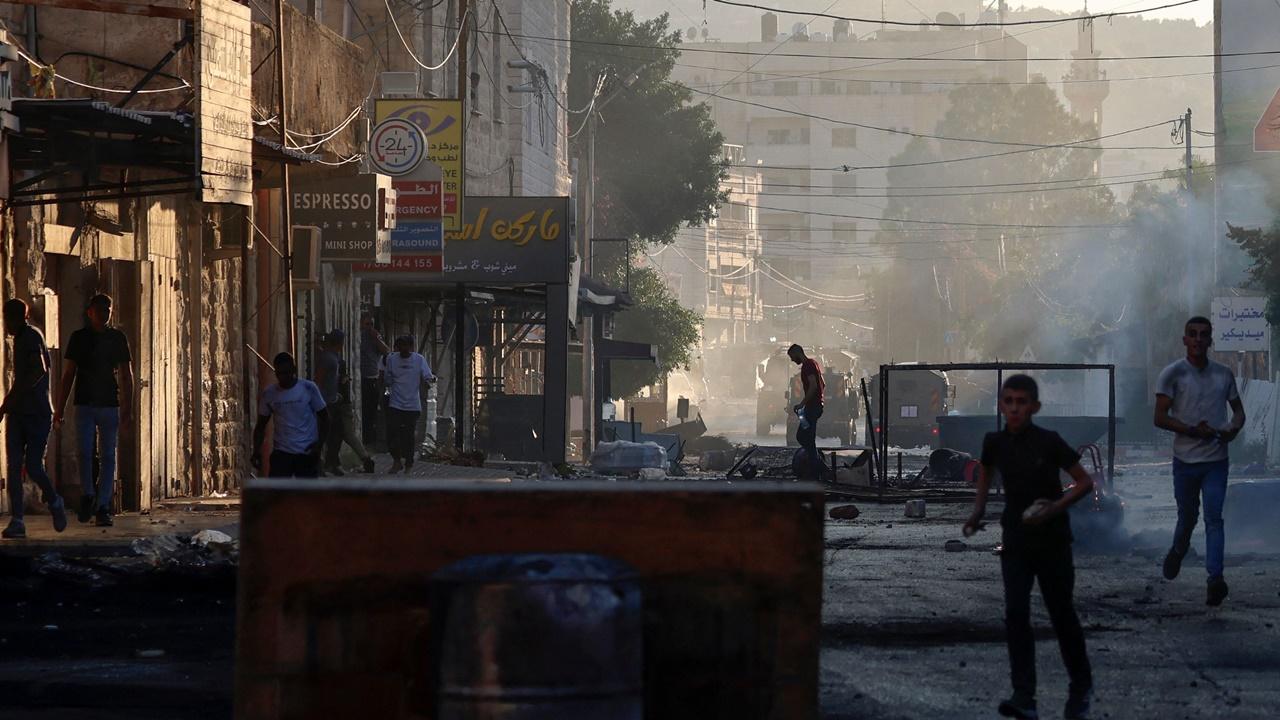 Residents said electricity was cut off in some parts and military bulldozers ploughed through narrow streets, damaging buildings as they cleared the way for Israeli forces. The Palestinians and neighbouring Jordan condemned the violence.