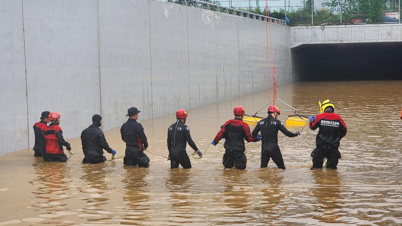 As of Monday afternoon, rescue workers had pumped out most of the water from the tunnel and were searching the site on foot, a day after they used rubber boats to move and transport bodies on stretchers.