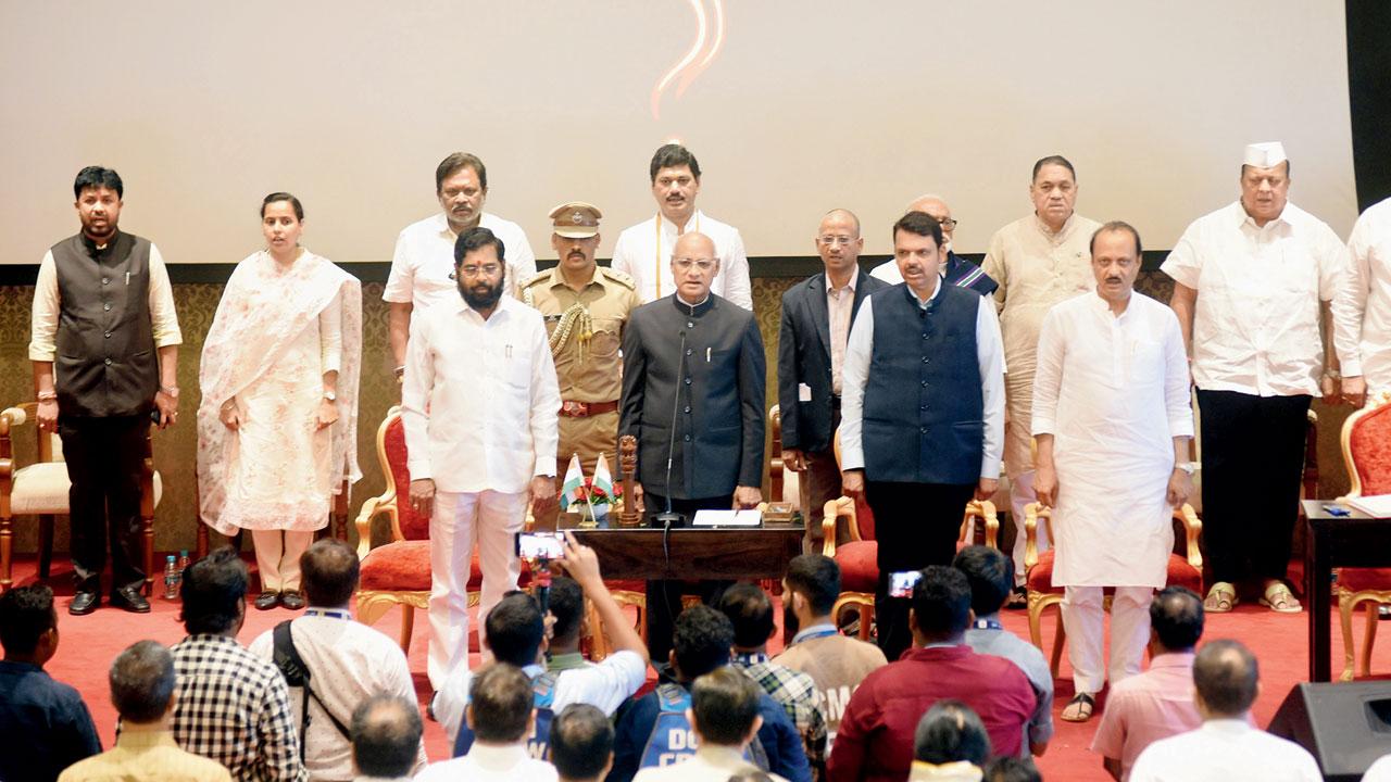 Ajit Pawar and eight other MLAs take oath as ministers in the Shinde-Fadnavis government, on July 2. Several of these MLAs have been accused of corruption and are being probed. Pic/Sameer Markande