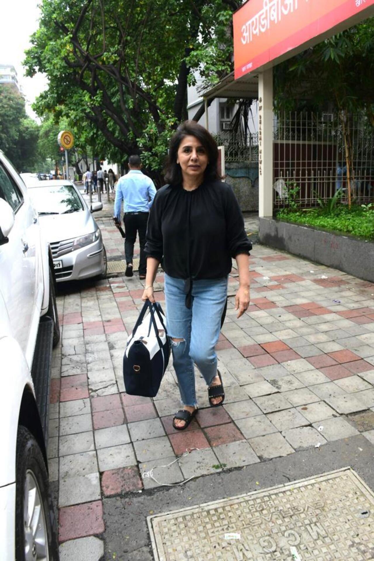 Neetu Kapoor was seen wearing a black shirt as she paired it with blue jeans