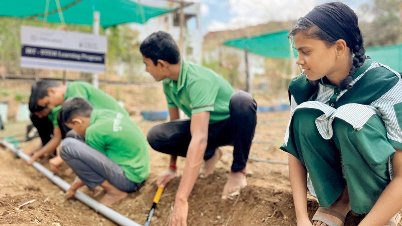 Students conduct a practical experiment, at Sumati Balwan school