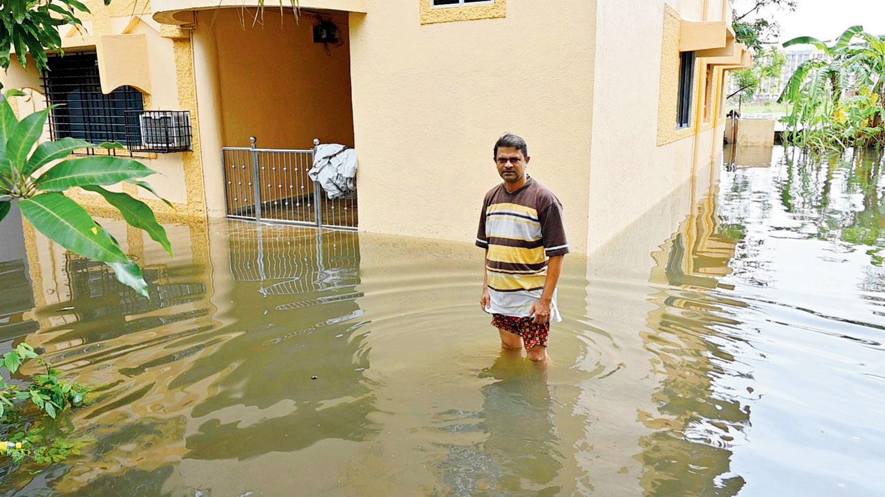 Sebastian Assao outside his home, which is among the bungalows that were submerged. Pics/Hanif Patel