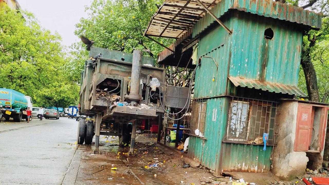 A garbage compactor parked in Versova is of no use, as people find it difficult to dump trash inside, say locals