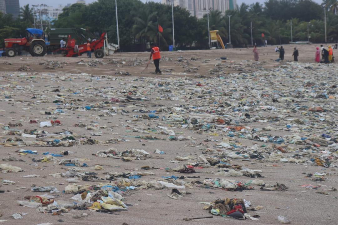 In Photos: BMC workers clean garbage that washed ashore Girgaon Chowpatty