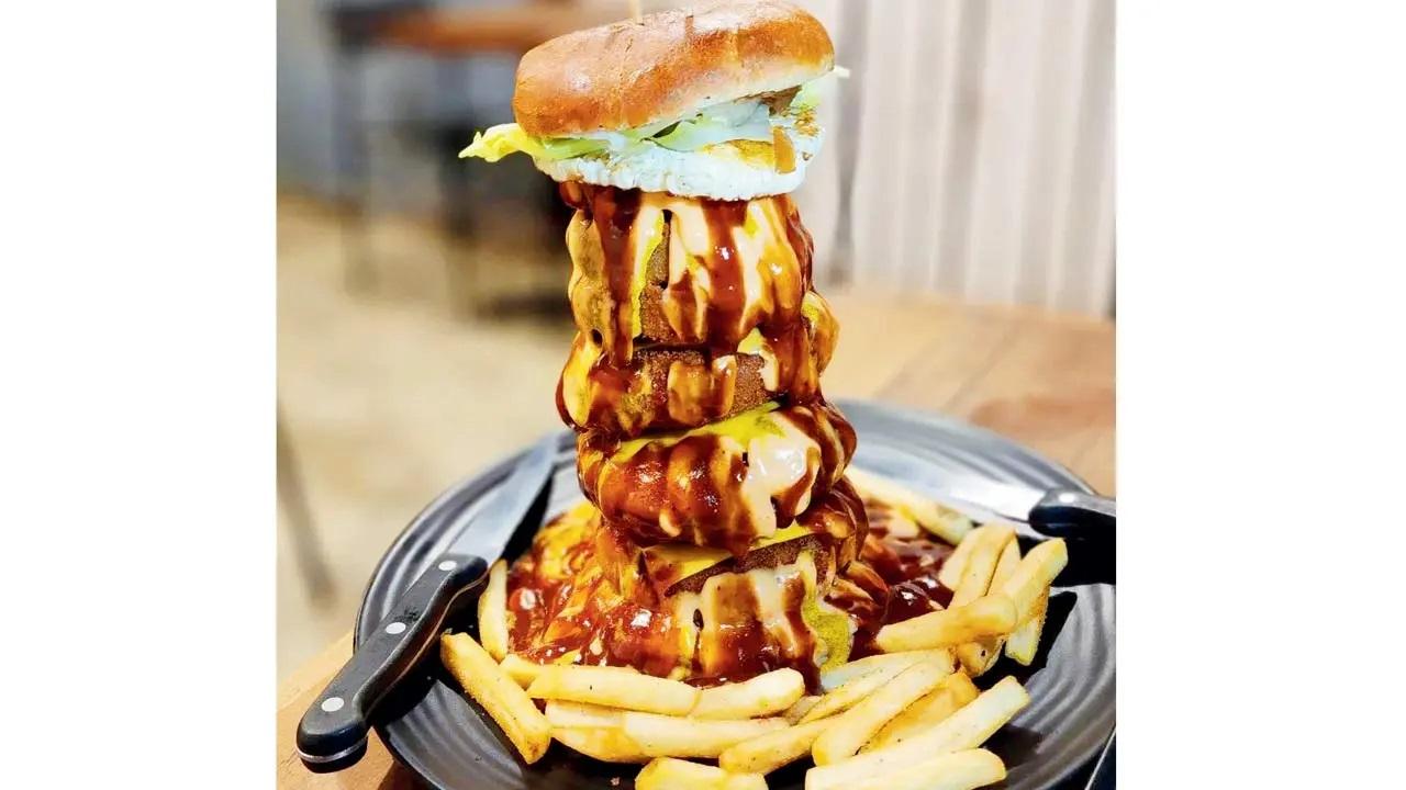 Godfather burger: Nothing spells the American Dream like a mafia-esque burger that comes drenched in barbeque sauce, crushed fried onion rings and a fried egg. At Howra Burger, Hill Road, Bandra West; Ballard Estate, Fort. Log on to Swiggy; Zomato Cost Rs 550
