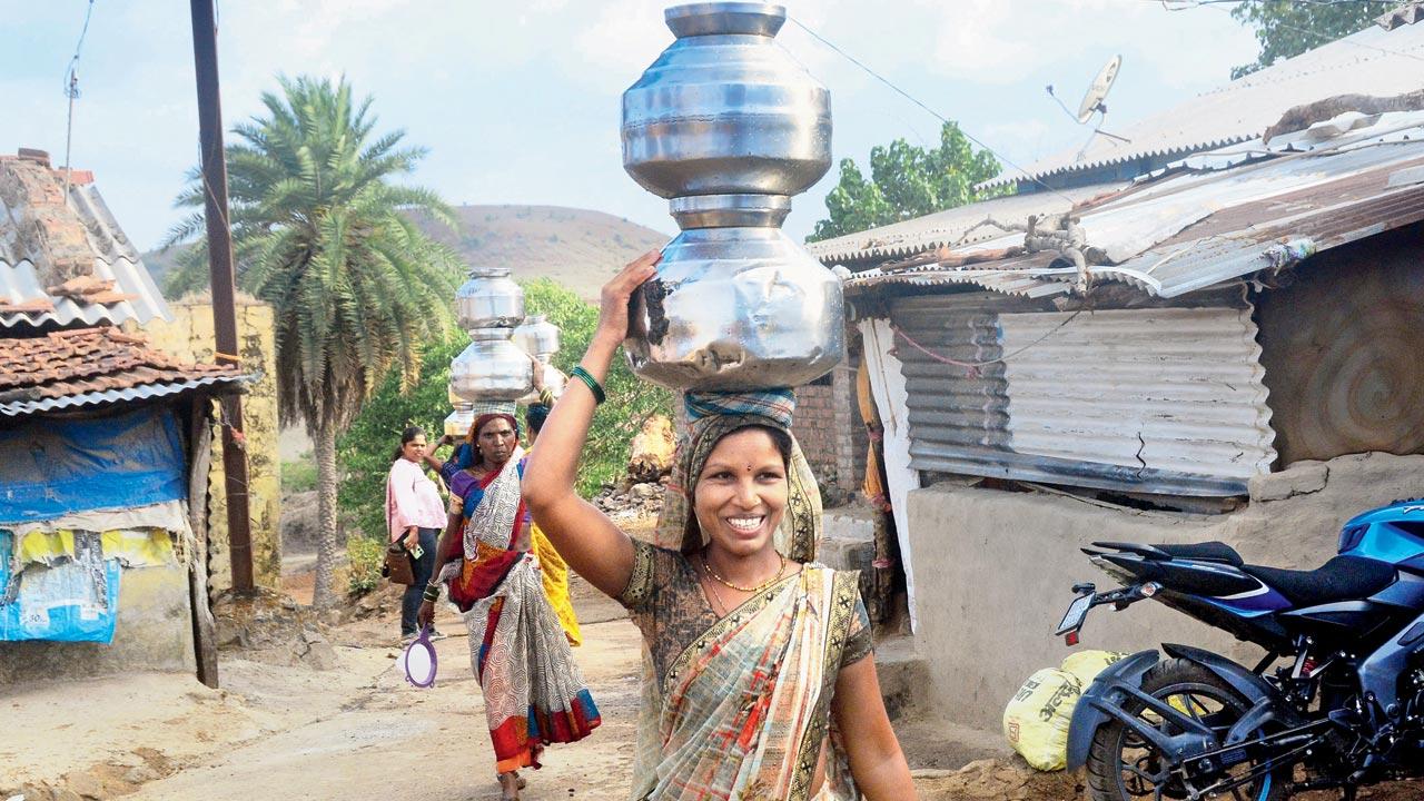 Twenty-seven-year-old Chandrakala Korde, sarpanch of Brahmanwade, says despite being the head of the village, she, too, goes to fetch water from the neighbouring hand pump, as men in the household refrain from the task. Last year, she collapsed while walking home with the handis, and was bedridden for nearly eight days. 