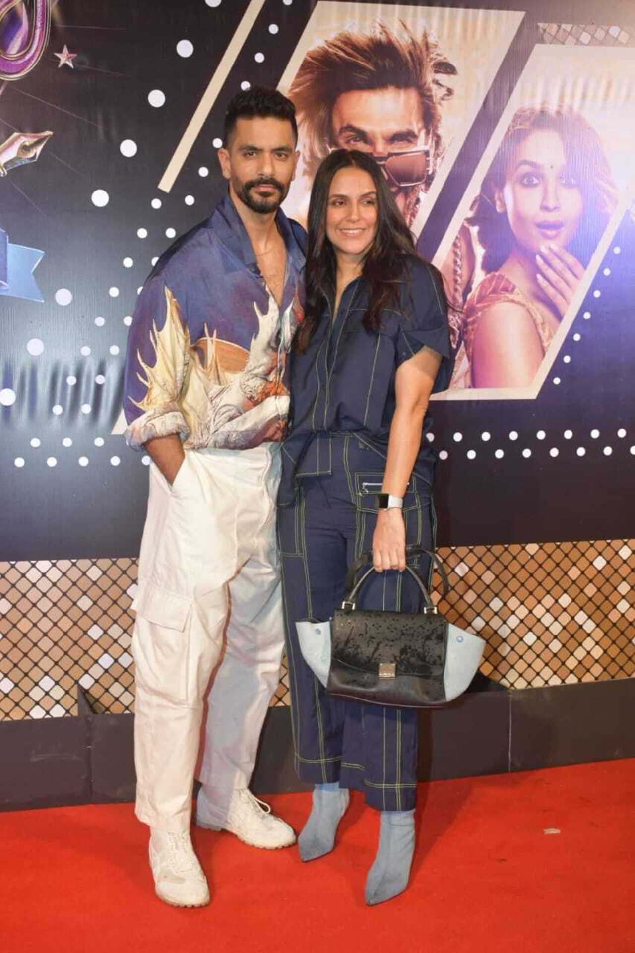 Neha Dhupia looked gorgeous in a blue outfit as she attended the special screening of 'Rocky aur Rani Kii Prem Kahaani' with her husband Angad Bedi