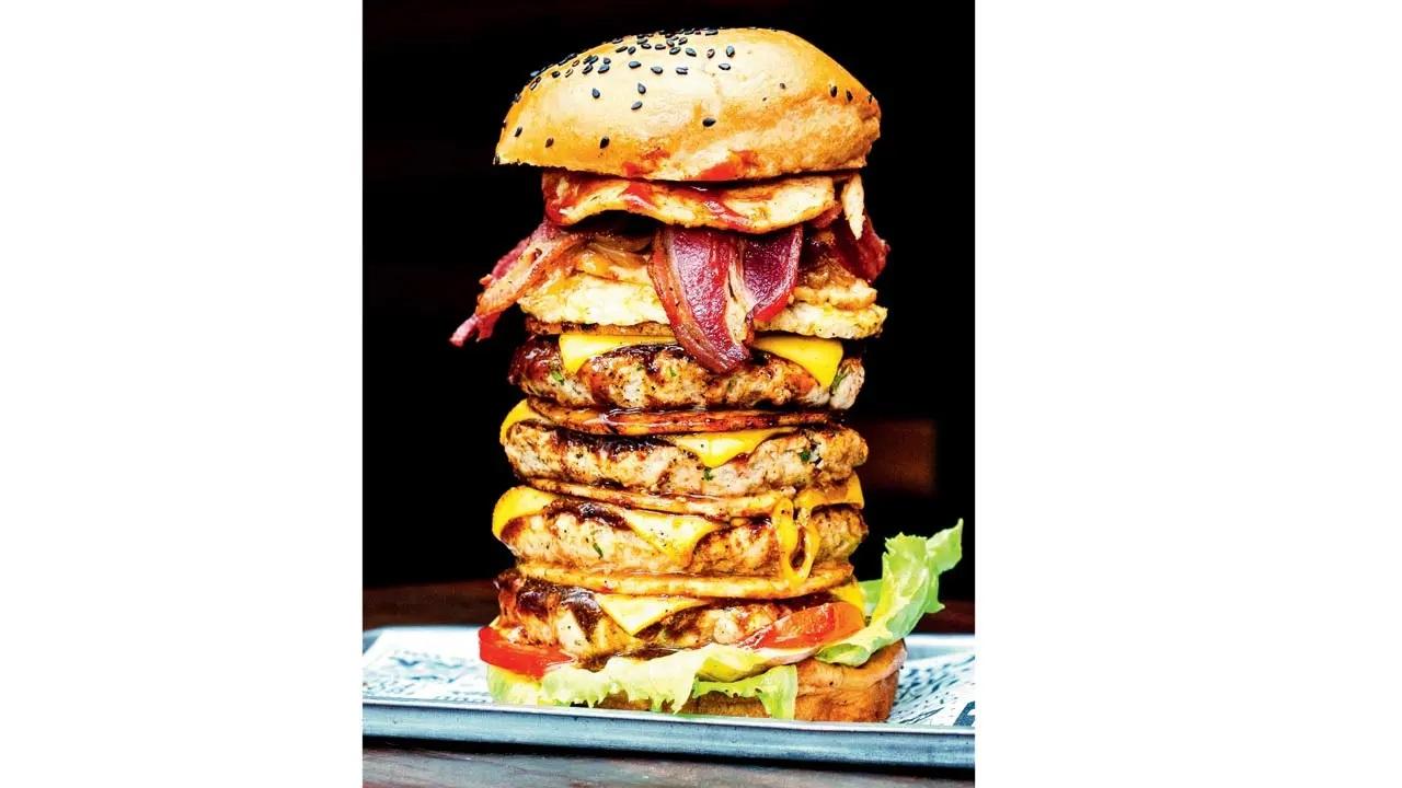 Jawbreaker: The name is all you need. A seven-inch culinary jenga of juicy patties, salami, fried eggs and bacon, the jawbreaker is a real mouthful. With a vegetarian version available, it remains a fan favourite. At Jimi’s Burger, Evershine Nagar, Malad West; Pali Naka, Bandra West; Lokhandwala, Andheri West. Log on to Zomato Cost Rs 449 (vegetarian); Rs 479 onwards (non-vegetarian)